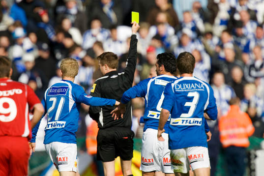Domare, gult kort