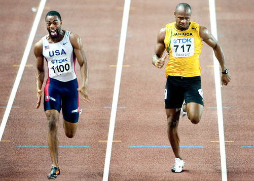Tyson Gay, USA vinner 100 meter. Asafa Powell, Jamaica bara