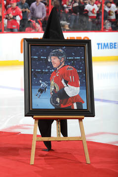 Daniel Alfredsson has his jersey with his number 11 retired