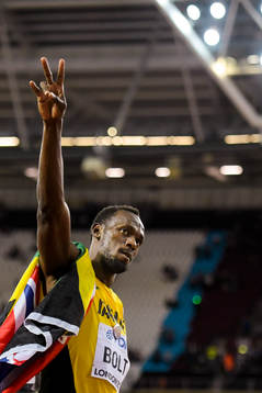 Jamaicas Usain Bolt som slutade på tredje plats jublar