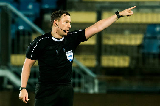 The referee Thoroddur Hjaltalin of Iceland