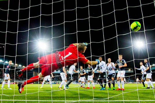 Nicklas Bendtner of Rosenborg scores 0-1 behind goalkeeper
