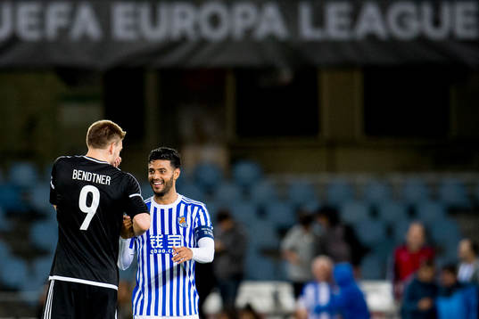 Nicklas Bendtner of Rosenborg talks to Carlos Vela of Real