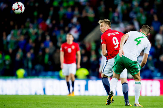 Alexander Toft Søderlund of Norway and Gareth McAuley of
