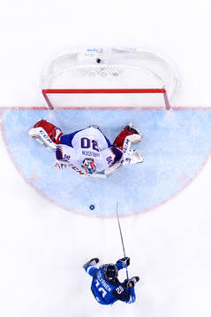 Eeli Tolvanen of Finland scores 2-1 behind goaltender Lars