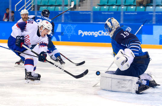 Ken André Olimb of Norway against Goaltender Mikko