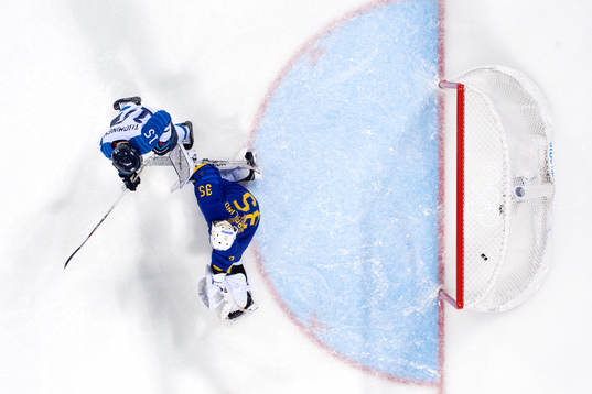 Finland scores a goal behind Goaltender Sarah Berglind of