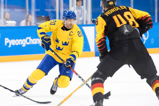 Joel Lundqvist of Sweden and Frank Hordler of Germany in