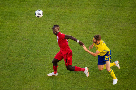 Luis Advincula of Peru competes for the ball with Marcus