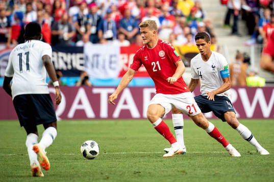 Andreas Cornelius of Denmark and Raphael Varane of France