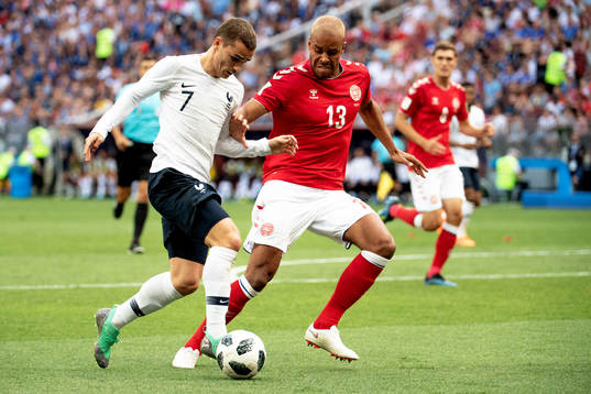 Antoine Griezmann of France and Mathias Jørgensen of