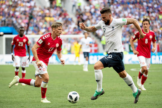 Jens Stryger Larsen of Denmark and Olivier Giroud of France