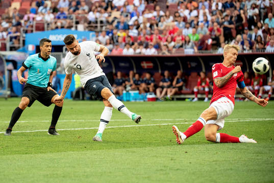 Olivier Giroud of France and Simon Kjaer of Denmark
