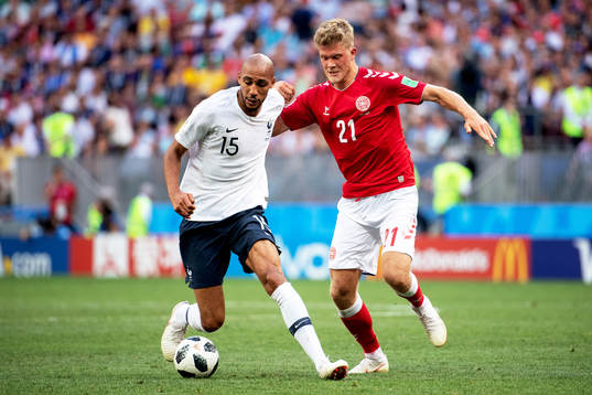 Steven Nzonzi of France and Andreas Cornelius of Denmark