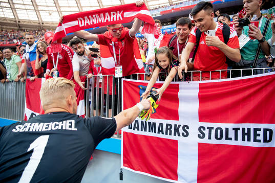 goalkeeper Kasper Schmeichel of Denmark give his gloves away