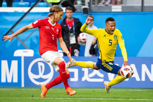 Martin Olsson falls and is awarded a penalty in a duel with