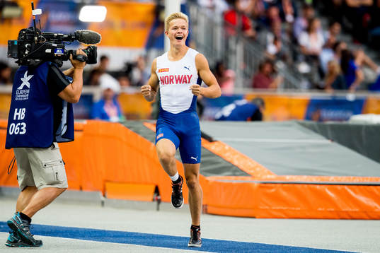 Sondre Guttormsen of Norway celebrates in the men's pole