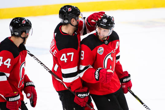 Miles Wood and John Quenneville of the New Jersey Devils
