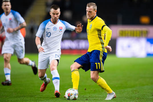 Albert Rusnak of Slovakia and John Guidetti of Sweden
