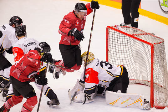 Max Friberg of Frölunda and goalkeeper Elvis Merzlikins of