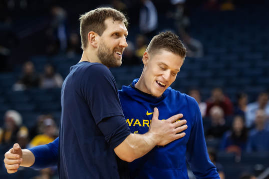 Dirk Nowitzki of Dallas Mavericks and Jonas Jerebko of
