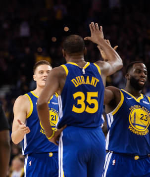 Jonas Jerebko, Levin Durant and Draymond Green of Golden