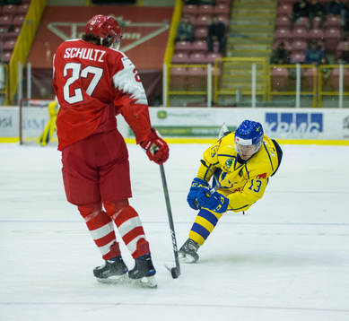 Sweden forward Johan Södergran (13)  shoots past Denmark