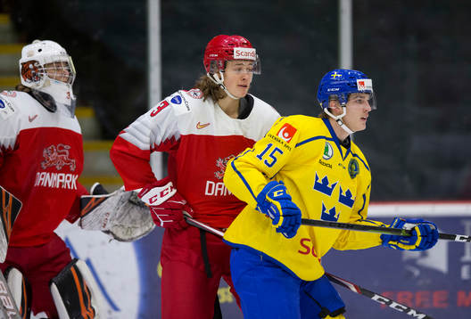 Denmark defenceman Malte Setkov (3) battles with Sweden
