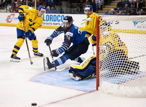 Kaapo Kakko of Finland falls in front of goal