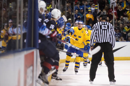 Rickard Hugg of Sweden celebrates with teammates