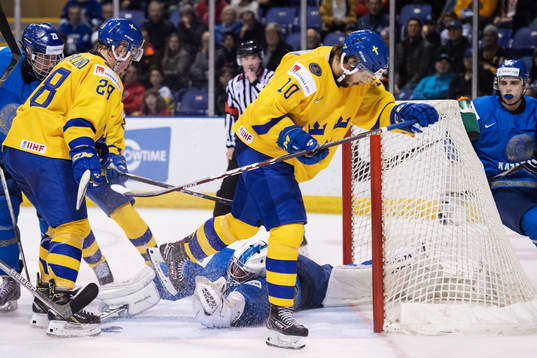 Goaltender Denis Karatayev of Kazakhstan stops the puck in