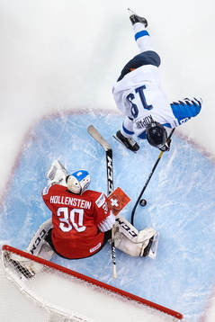 Rasmus Kupari of Finland in action against goaltender Luca