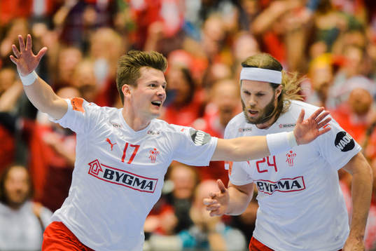 Lasse Svan and Mikkel Hansen of Denmark celebrates