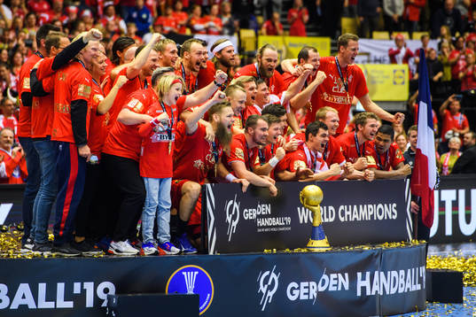 Players of Denmark celebrates at the podium with the trophy