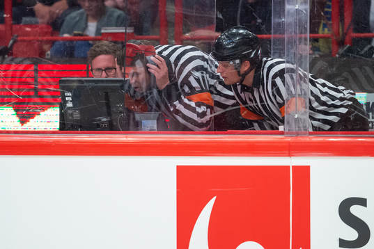 Referees looking at a video to allow or disallow Swedens