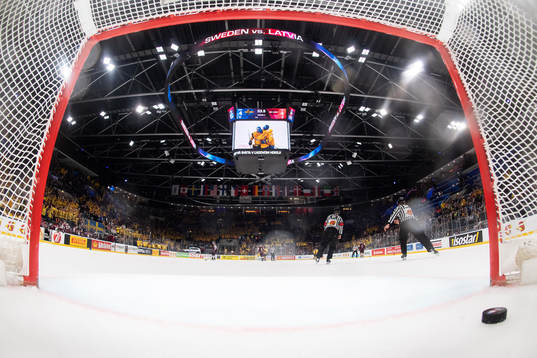 The puck lies in the net of Latvia