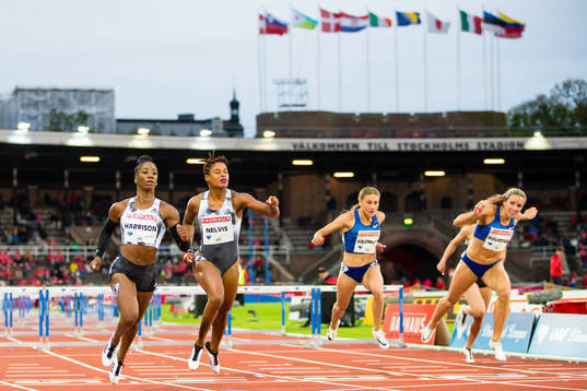 Kendra Harrison of USA (L) finish first in the women's 100m