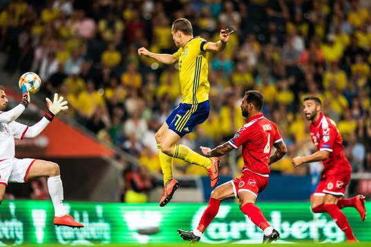 Viktor Claesson of Sweden scores 2-0 behind goalkeeper