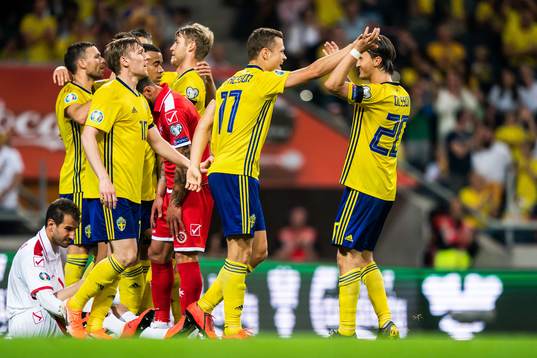 Viktor Claesson of Sweden celebrate with Emil Forsberg and