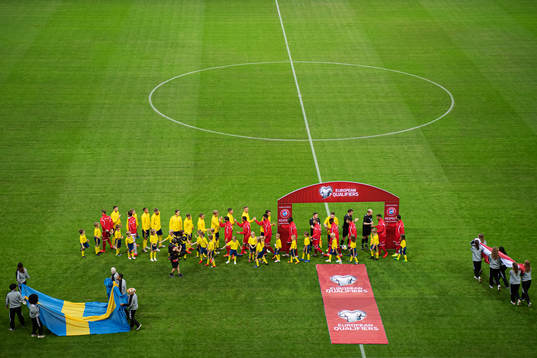 Players of Sweden and Malta greet each other
