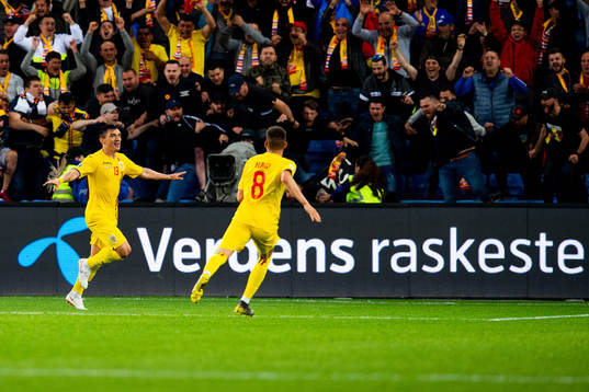 Claudiu Keseru of Romania celebrates with teammates
