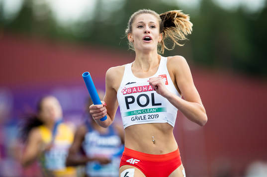 Natalia Kaczmarek of Poland crosses the finish line as gold