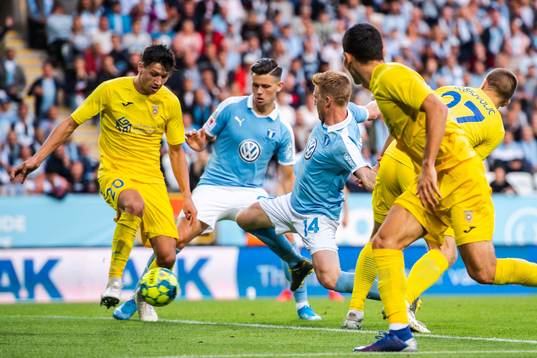 Anders Christiansen of Malmö FF and Sven Karic of Domzale