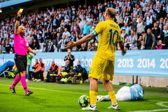 Senijad Ibricic of Domzale receives a varning from referee