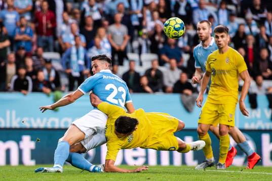 Marcus Antonsson of Malmö FF and Sven Karic of Domzale