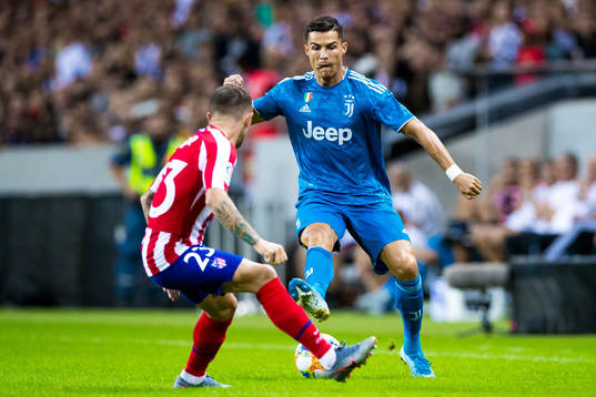 Kieran Trippier of Atletico Madrid and Cristiano Ronaldo of