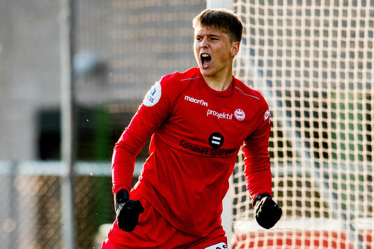 Goalkeeper Markus Vassøy Nilsen of Sandnes Ulf celebrates