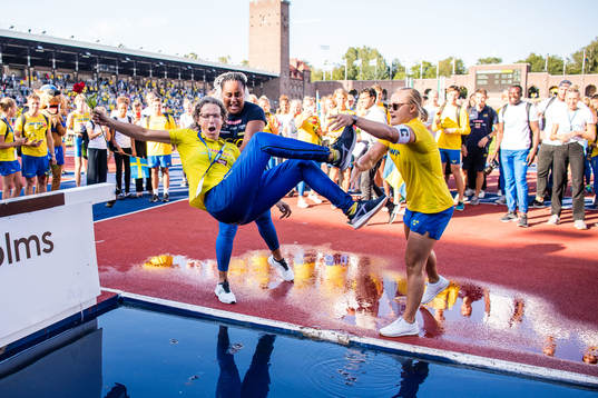 Karin Torneklint, coach of Sweden, is thrown into the water