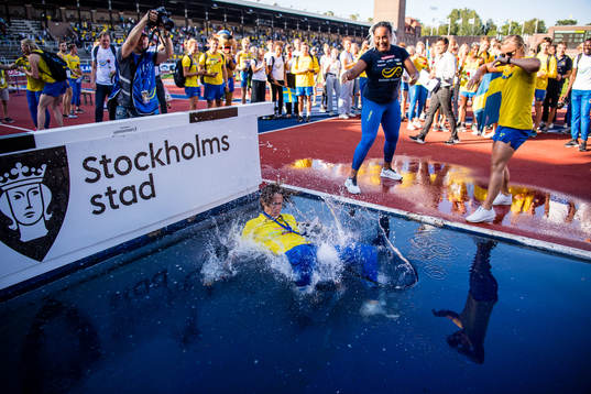 Karin Torneklint, coach of Sweden is thrown into the water
