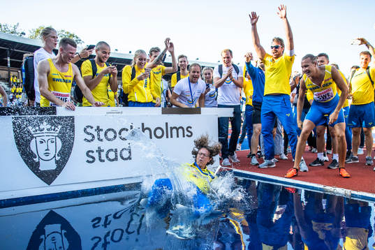 Karin Torneklint, coach of Sweden is thrown in the water